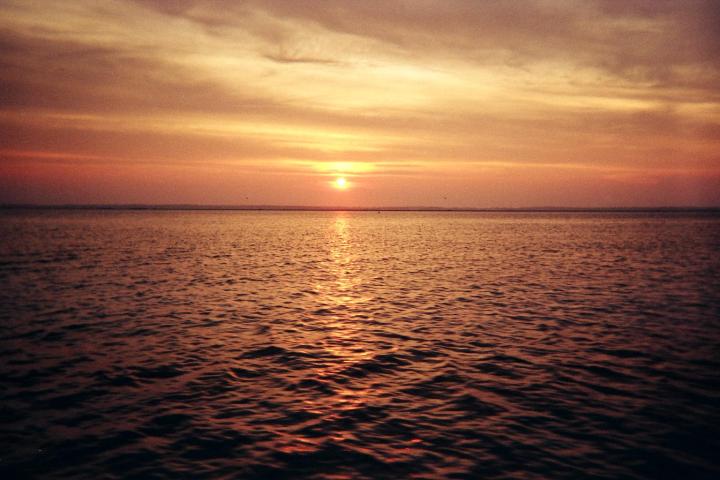 a sunset over a body of water