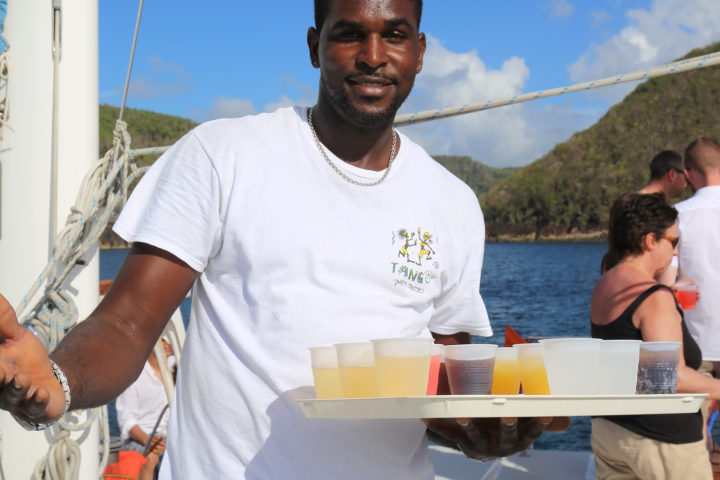 a group of people standing on a boat