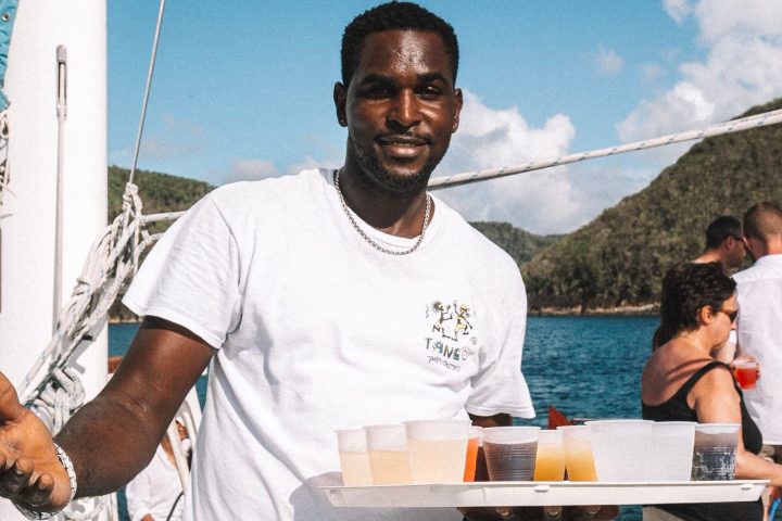 a man standing next to a bridge