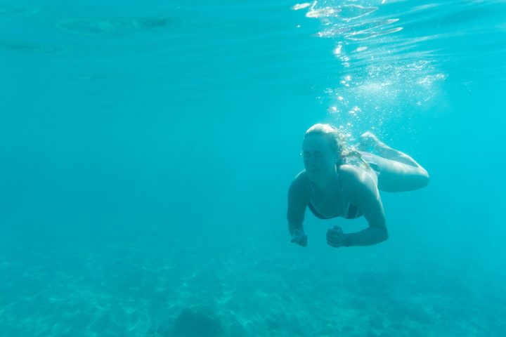 a person swimming in a body of water
