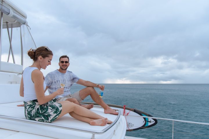 a person sitting in a boat on a body of water
