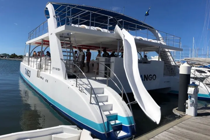 a boat is docked next to a body of water