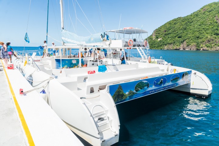 a boat is docked next to a body of water