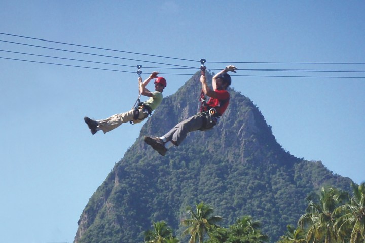a person jumping in the air on a mountain