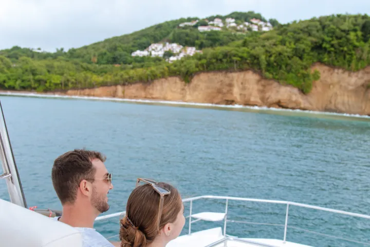a person sitting in front of a body of water