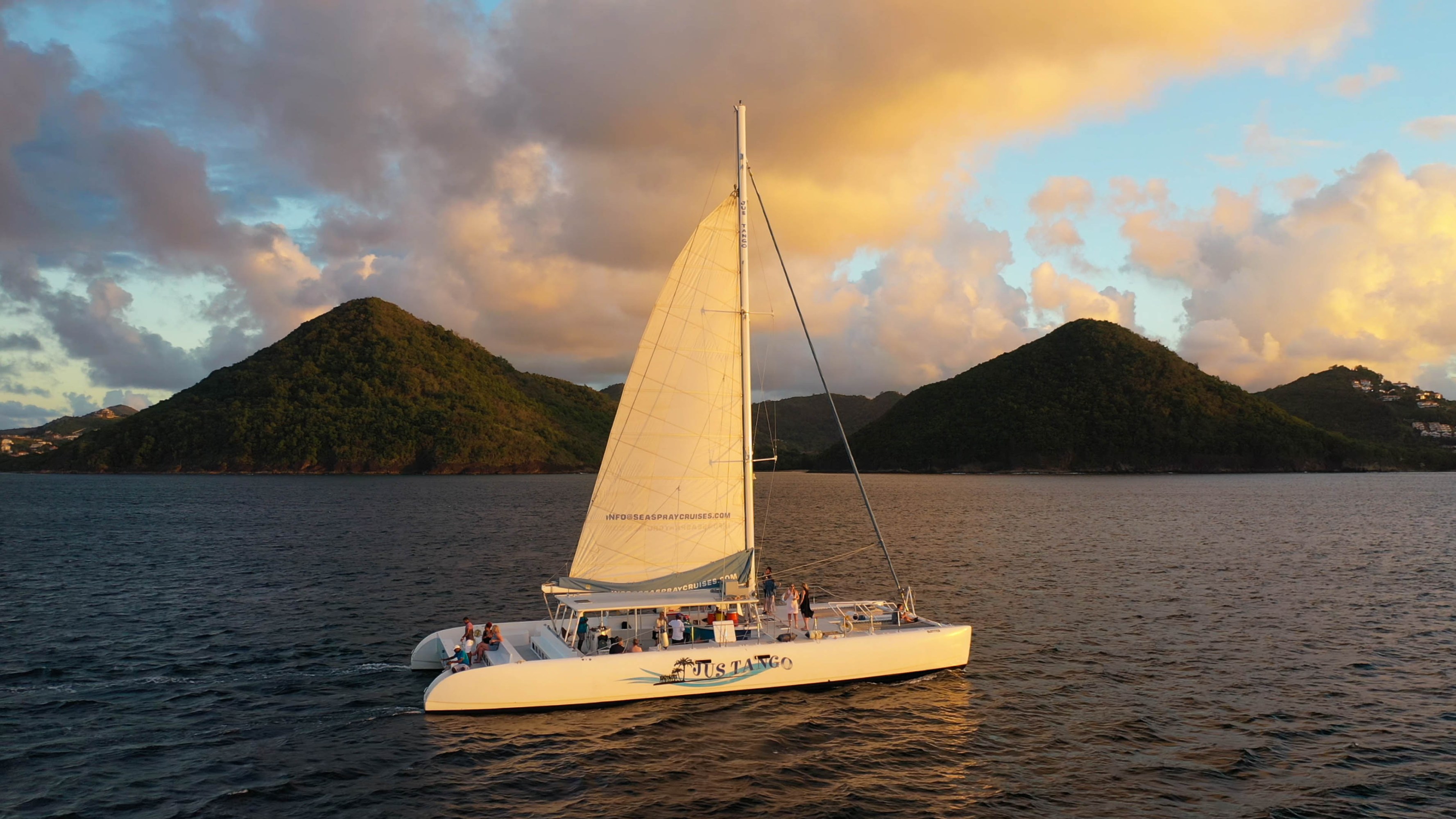 a small boat in a body of water with a mountain in the background