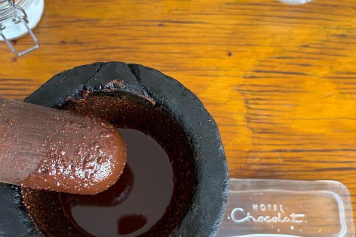 a chocolate doughnut and a cup of water