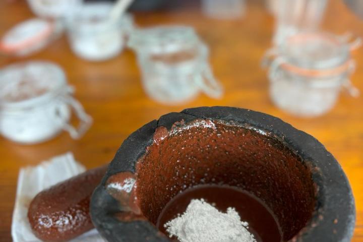 a close up of a doughnut sitting on top of a wooden table