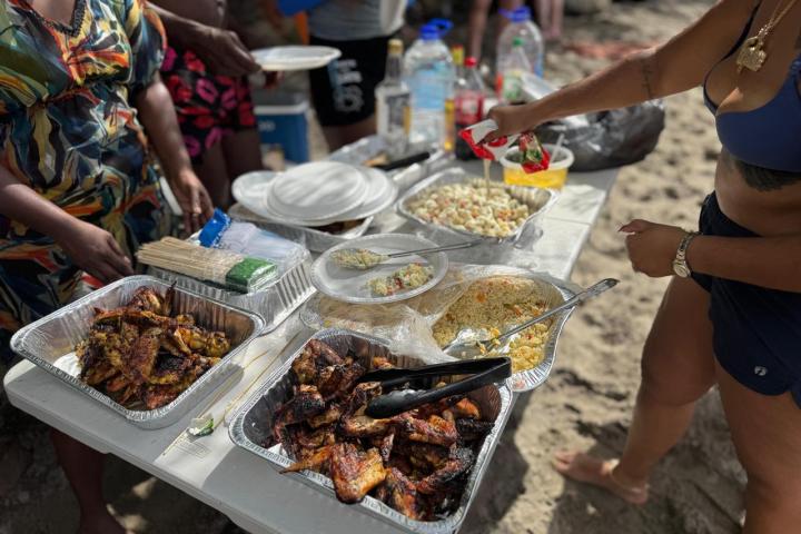 a group of people preparing food on a table